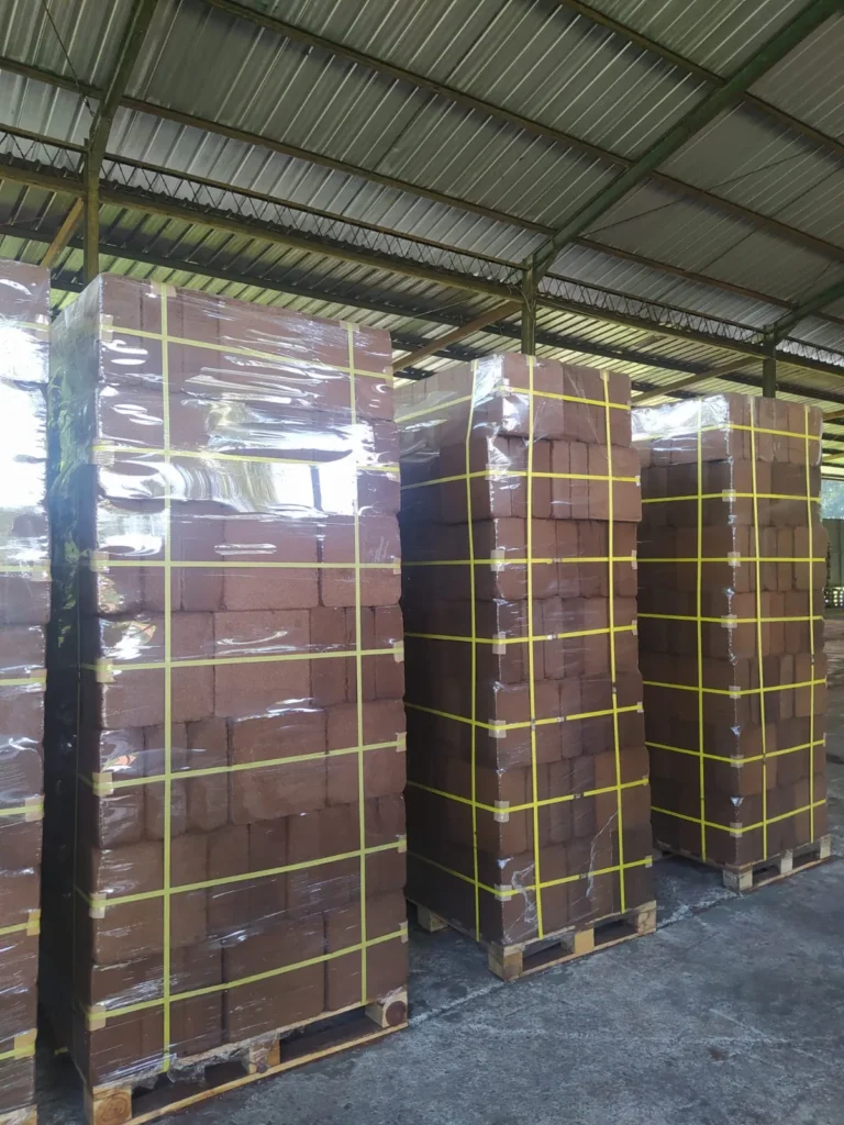 Multiple pallets of compressed cocopeat blocks wrapped and ready for shipment